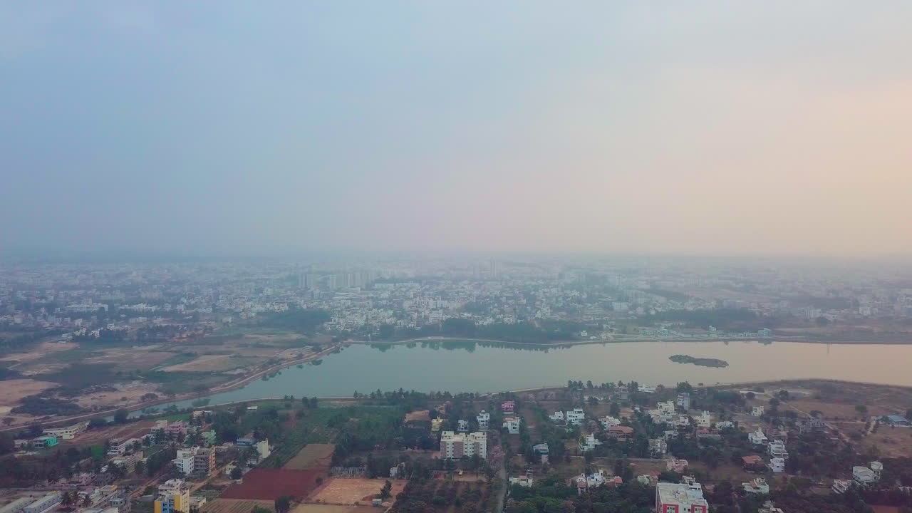 Drone shot of cityscape of Bangalore with Kalkere Lake in Karnataka.