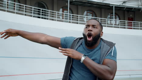 athlete in sportswear dancing on stadium