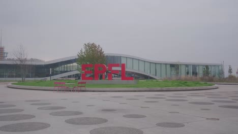 establishing shot of rolex center at epfl with logo in lausanne switzerland