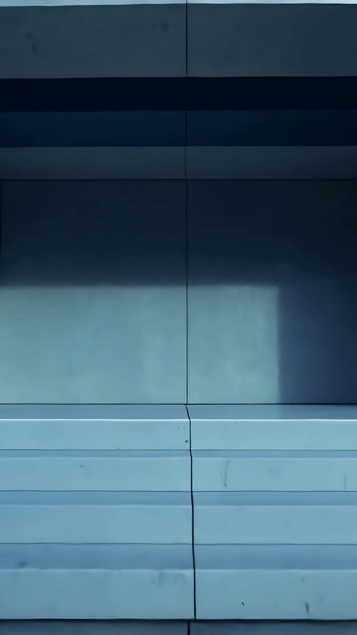 Vertical video: Sliding camera on slider revealing facade recessed bay at plaza to capture shadows