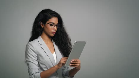 young african woman uses a digital tablet