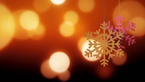 los adornos de copos de nieve de navidad se balancean en el fondo de bokeh archivo de bucle