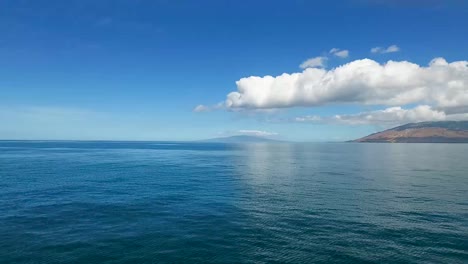 over ocean from kamaole beach on maui hawaii toward lanai island, aerial view