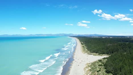 aerial climb showing beautiful turquoise-colored ocean at woodend beach, pegasus bay