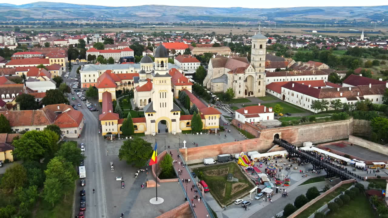Aerial drone view of Alba Carolina Citadel in Alba-Iulia, Romania. Cityscape, multiple buildings, churches, people