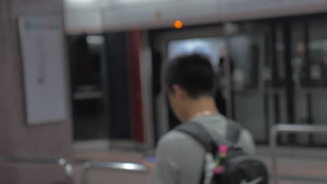 In-Hong-Kong-China-in-subway-a-young-girl-wears-a-medical-mask