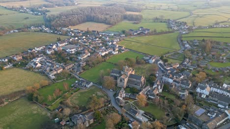 Aerial-footage-of-the-Medieval-village-of-Cartmel-in-the-English-Lake-District-it-has-a-rich-heritage,-and-varied-list-of-activities-for-visitors-and-tourists