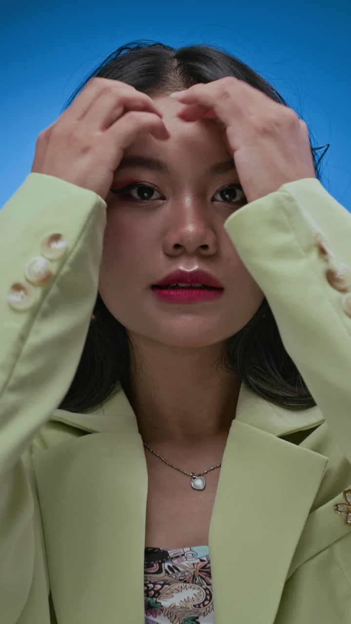 Gen Z Asian Woman Showing Different Poses to Camera Vertical