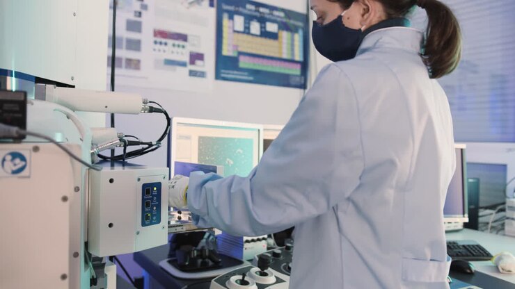 Scientist using a Scanning Electron Microscope (SEM)