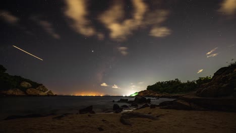 glowing cheung chau harbour coastline airplane shooting stars lights night sky timelapse hong kong