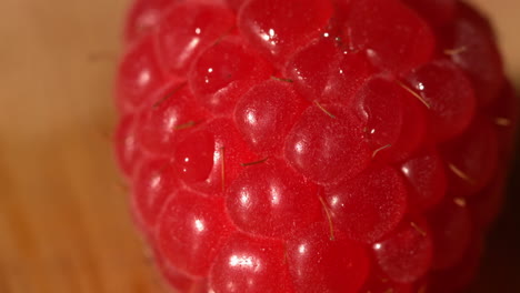 water pouring over a raspberry