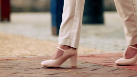 woman, fashion and shoes walking on street outside