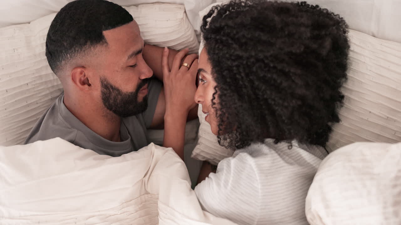 Love, wake up and morning with couple in bedroom