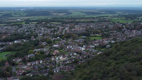 Aerial-view-above-Halton-North-England-coastal-countryside-town-estate-green-space-pan-right-shot