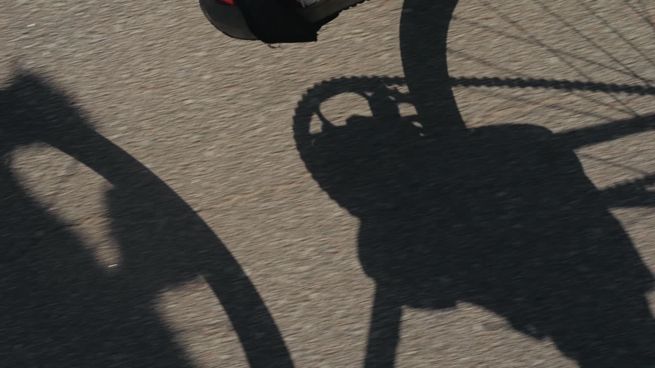 Shadow of a cyclist on a road