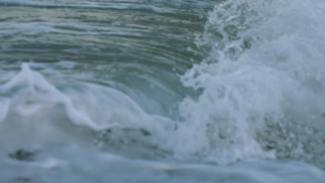 Slow-motion-footage-of-a-wave-curling-and-crashing-into-shore