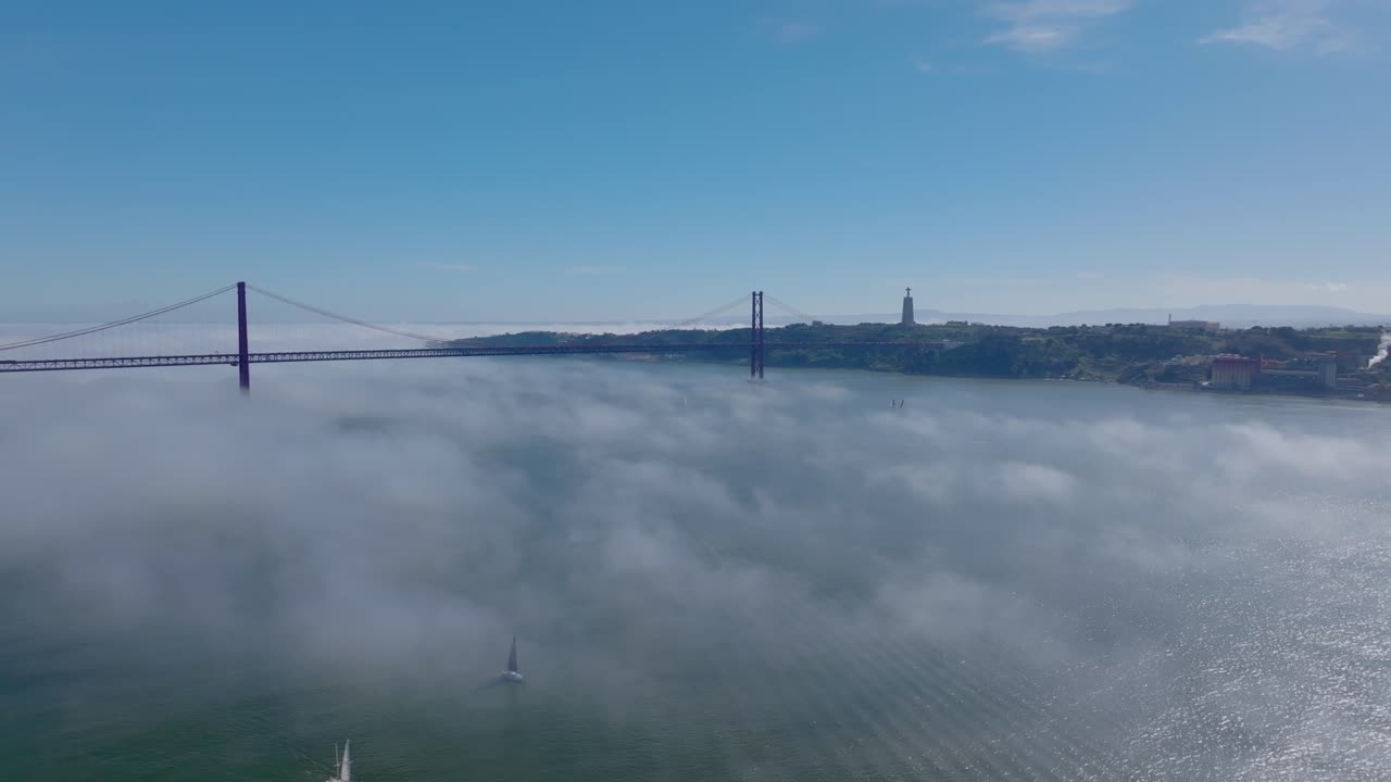 Drone shot of river Tejo in fog.