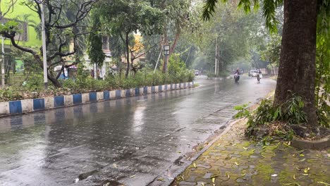 pov shot kolkata with yellow taxi during monsoon season in bengal