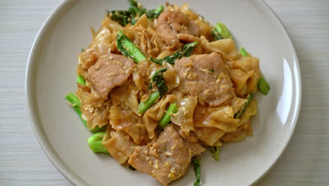 Stir-fried rice noodle with black soy sauce and pork and kale - Asian food style