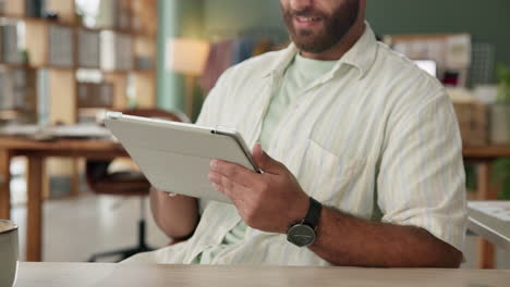 man using a tablet in an office