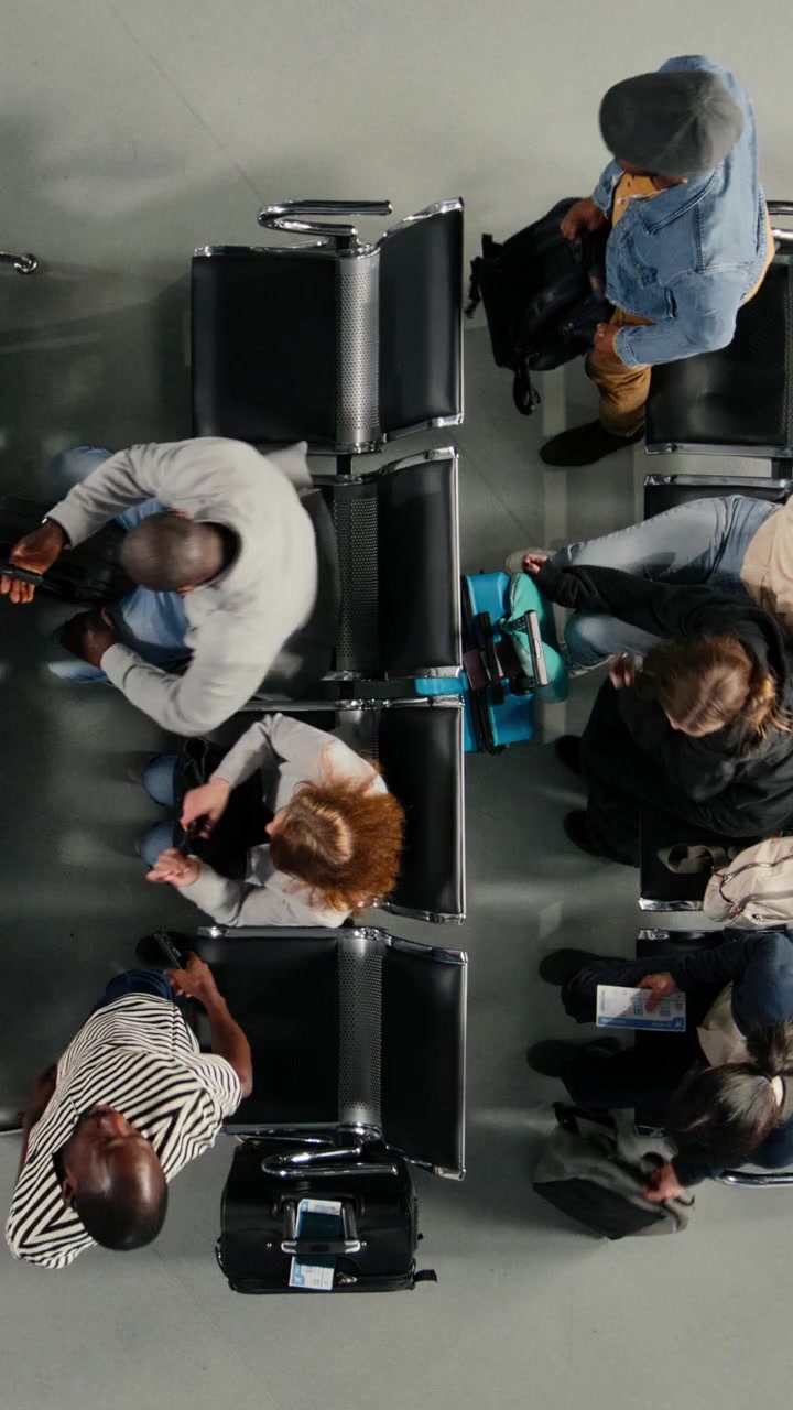 Overhead View of Diverse Passengers Departing from Airport Waiting Area