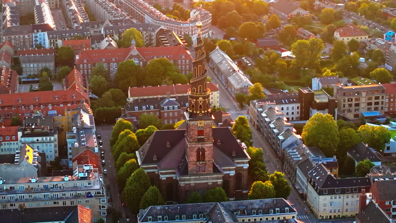 Aerial drone view of the Church of Our Saviour in the city centre of Copenhagen, Denmark at sunset
