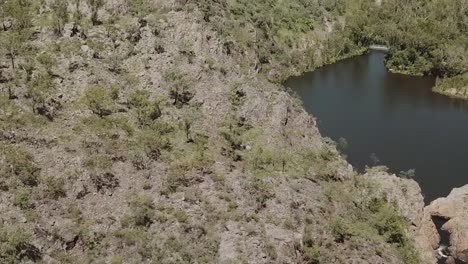 Flying-over-Australian-Outback,-river-stream-and-gorge