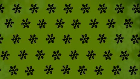 animación de copos de nieve cayendo sobre un fondo verde