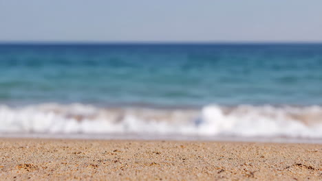blurred beach and ocean seascape with sand and waves