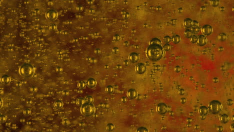 thousands-of-golden-coloured-translucent-bubbles-slowly-rise