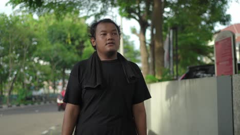 tired man walking outdoors