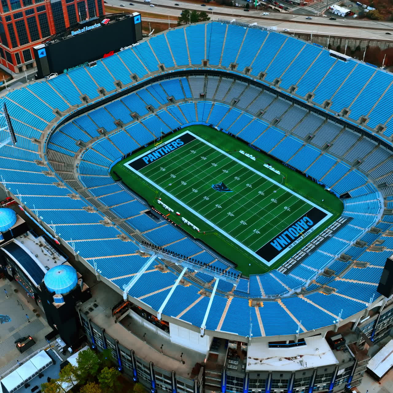 Football stadium in uptown Charlotte, North Carolina, United States. Top view on the Bank of America Stadium with slow distancing from it.