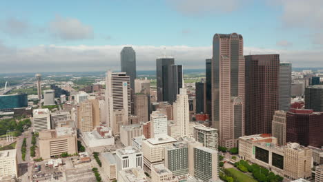 Aerial-view-of-tall-modern-office-downtown-buildings.-Orbiting-around-group-of-skyscrapers.-Dallas,-Texas,-US