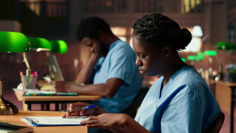 african american medical assistant prepares for exams in a library