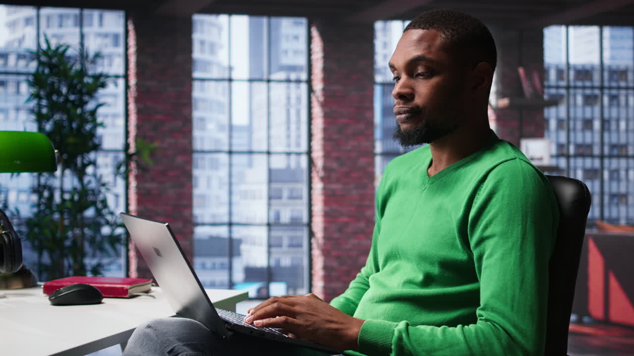 Vertical Video African american remote worker solving daily job assignments