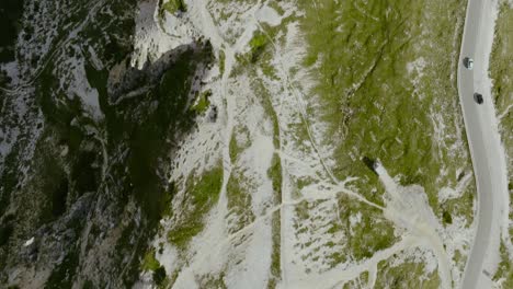 Aerial-drone-top-down-shot-of-car-parking-in-the-Dolomites-Alps-in-the-Tre-Cime-di-Lavaredo-Italy,-4k