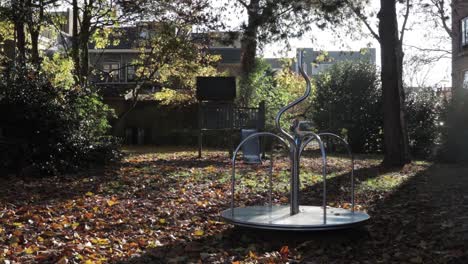 an empty playground, surrounded in autumn colors with a rotating playdevice!