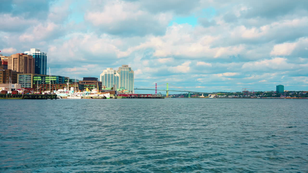 Boat tour exploring Halifax Downtown in Nova Scotia, Canada. Waterfront Skyline of the city. View of the financial district. Sightseeing of Halifax.