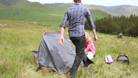 Couple-setting-up-their-tent-for-the-night