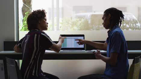 Diverse-business-colleagues-in-discussion-at-a-casual-meeting-in-the-office