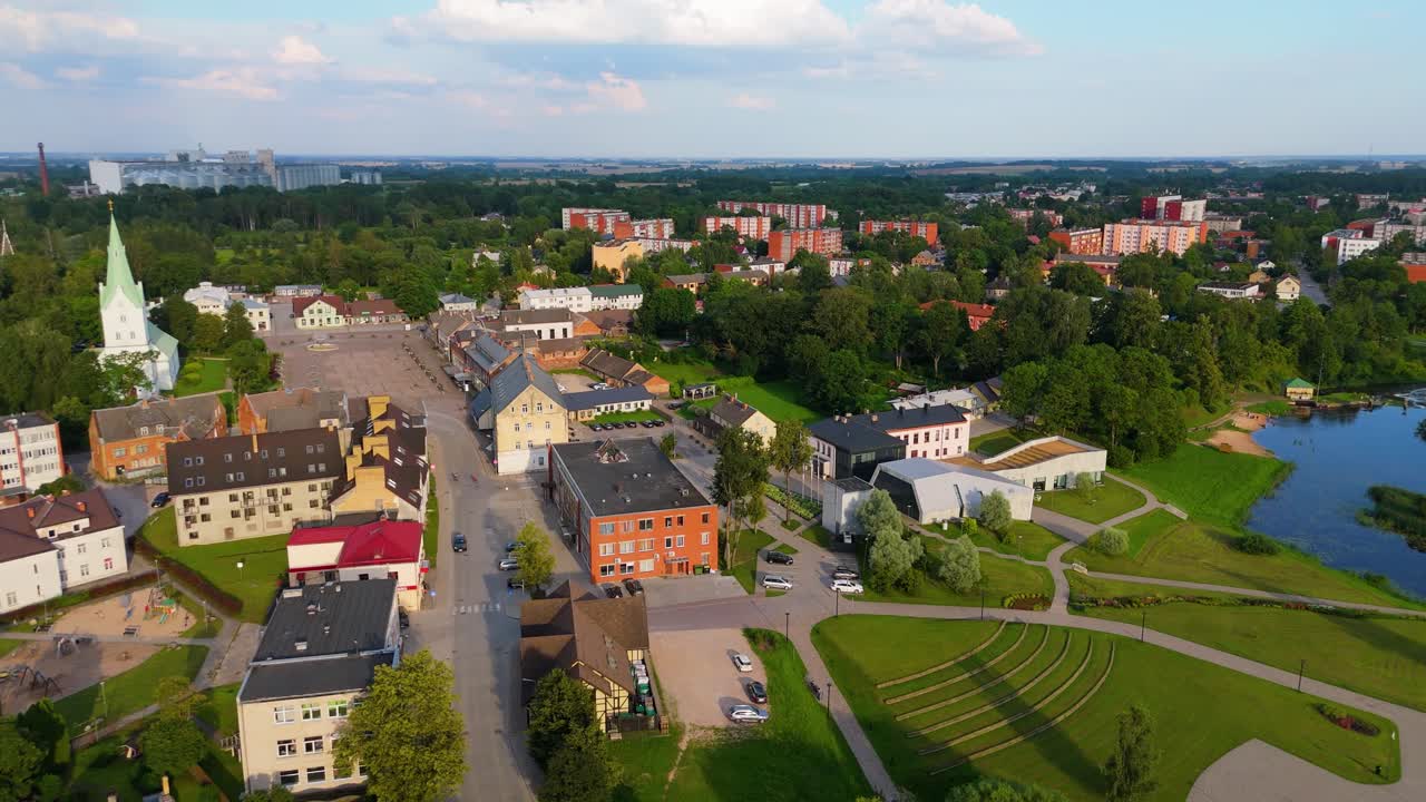 Aerial Panorama of Dobele Town Center and Evangelical Lutheran Church at Summer Scenic Drone View in Golden Hour Light Over Dobeles Historic Center on a Warm Summer Evening Peaceful Latvian Town