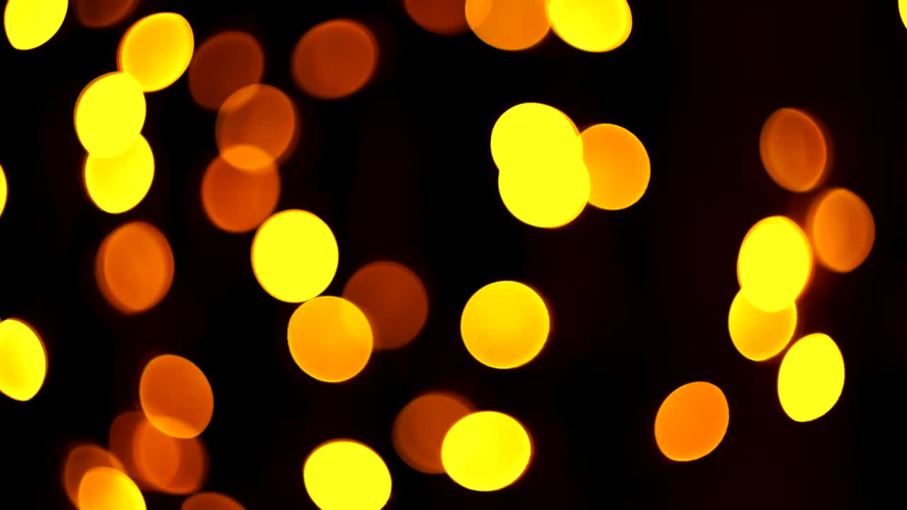 multicolored christmas abstract bokeh beautifully flashing on a dark background out of focus