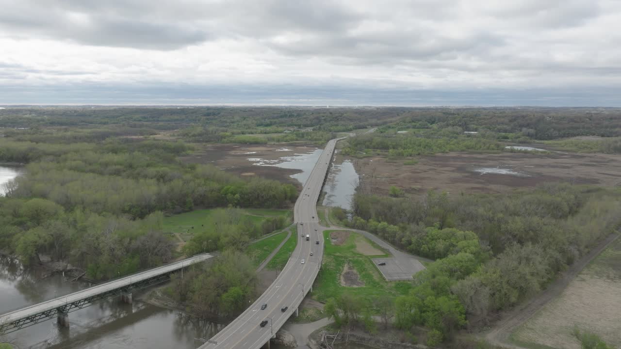 Cars Driving On Freeway 101 Over The Minnesota Valley National Wildlife Refuge Near Shakopee, Minnesota, USA. - aerial shot