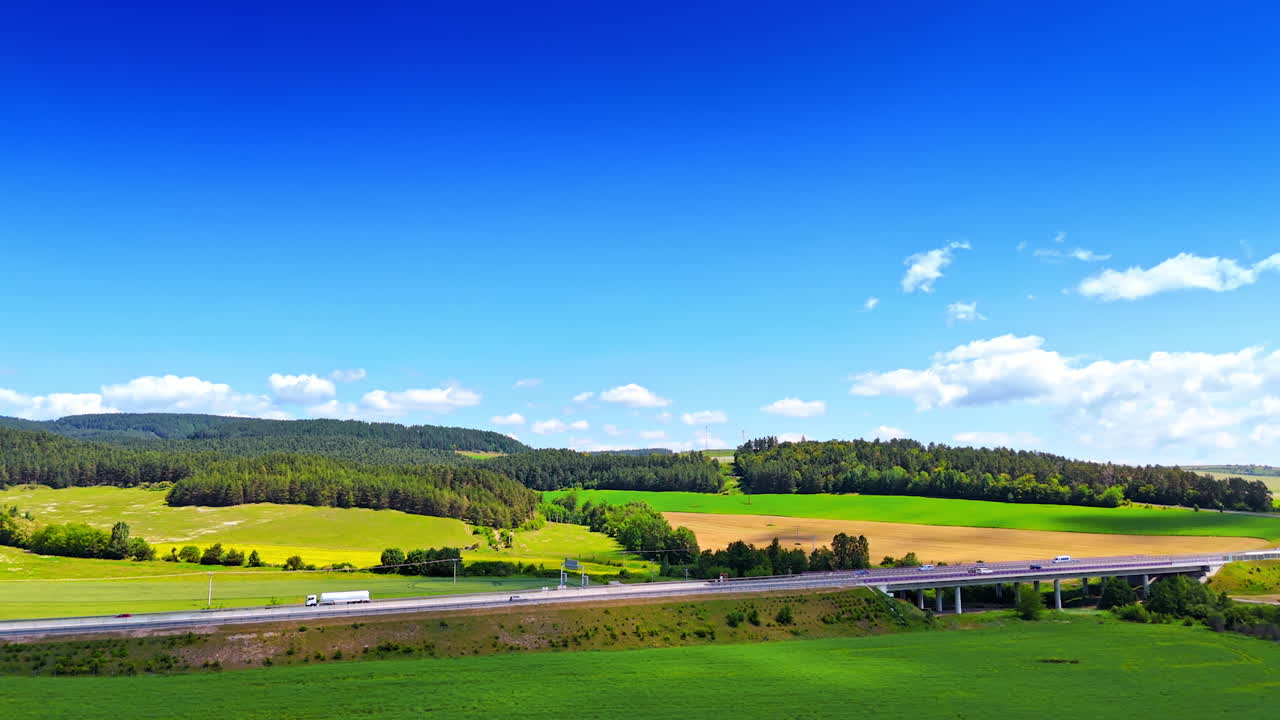 Beautiful nature landscape crossed by the straight highway. Picturesque rural area in Slovakia