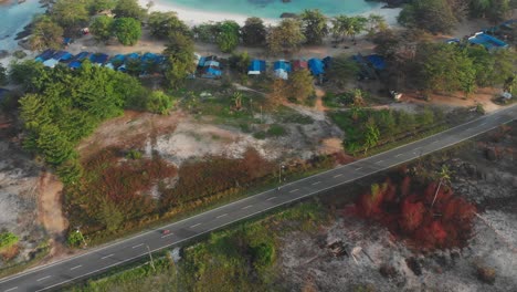 Stunning-Tanjung-Tinggi-beach-in-Belitung,-famous-for-its-rocks-during-sunrise,-aerial