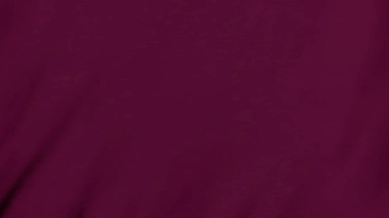 Abstract Background of Moving Dark Shadows on Deep Purple Fabric