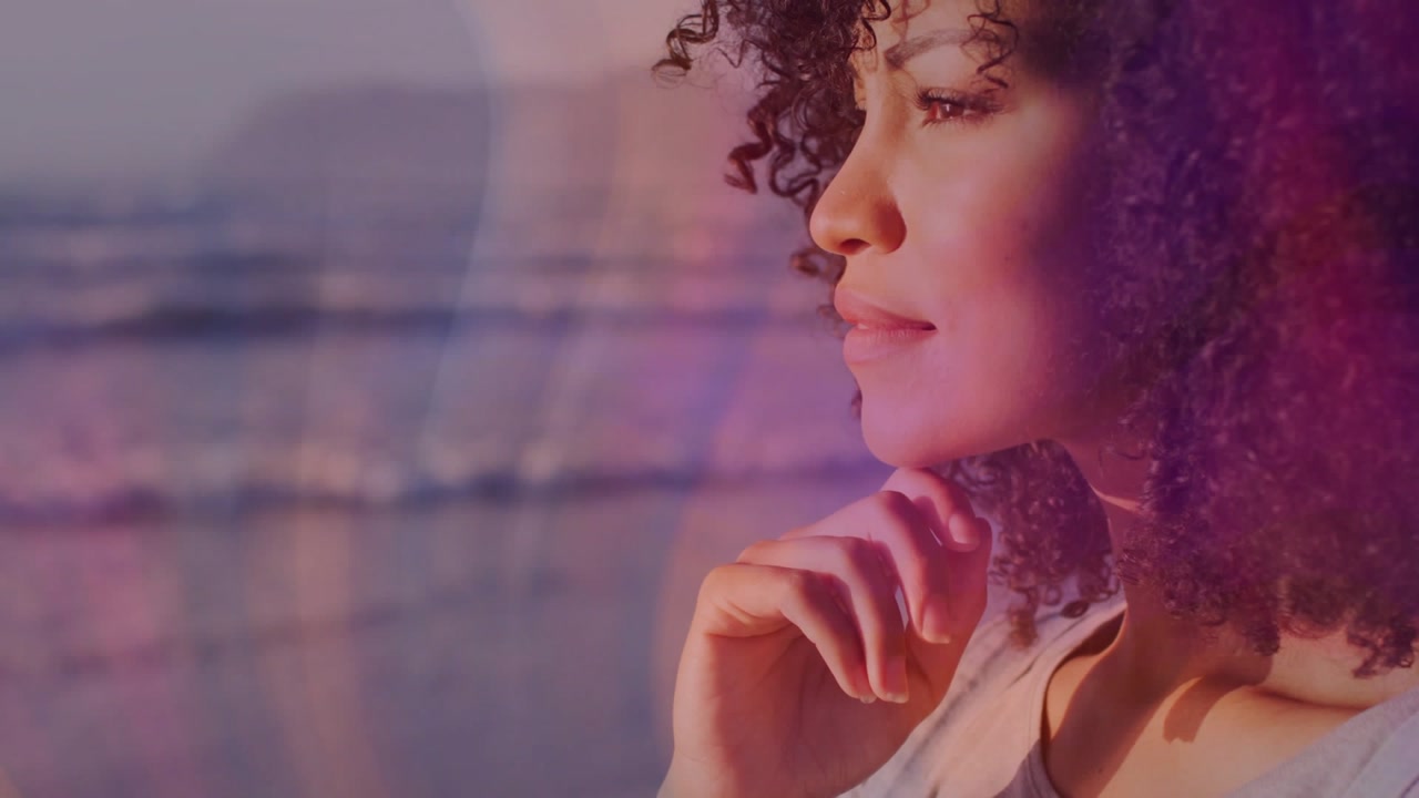 Sunset light drawing gaze, woman, curly hair, sitting by window turning head, revealing ocean view
