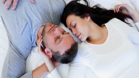 Romantic-couple-sleeping-on-bed-4k