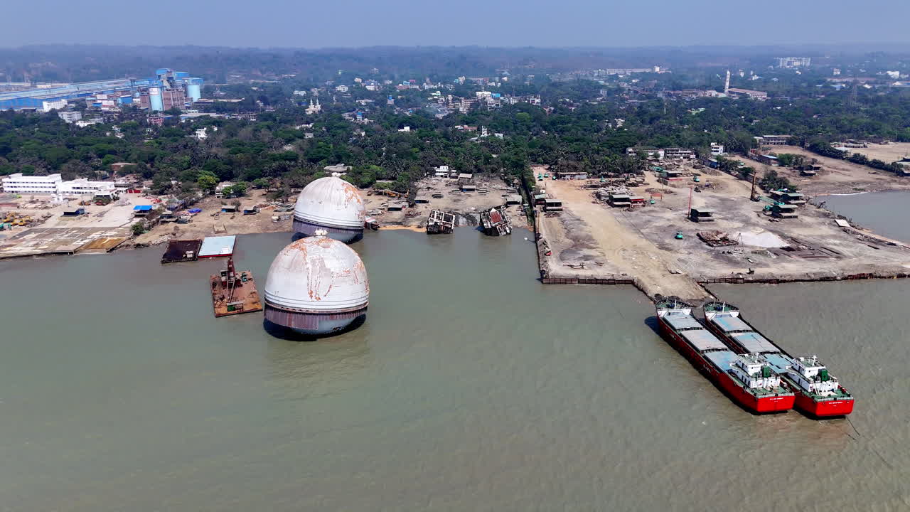 Cinematic aerial drone shot overtop a ship graveyard in Bangladesh