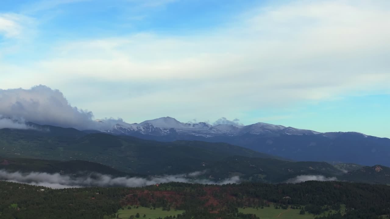 Foggy Front Range Rocky Mountains Mount Blue Sky Evans foothills valley of Evergreen Colorado aerial drone summer spring Marshdale Conifer Bailey Arapaho National Forest morning clouds parallax left